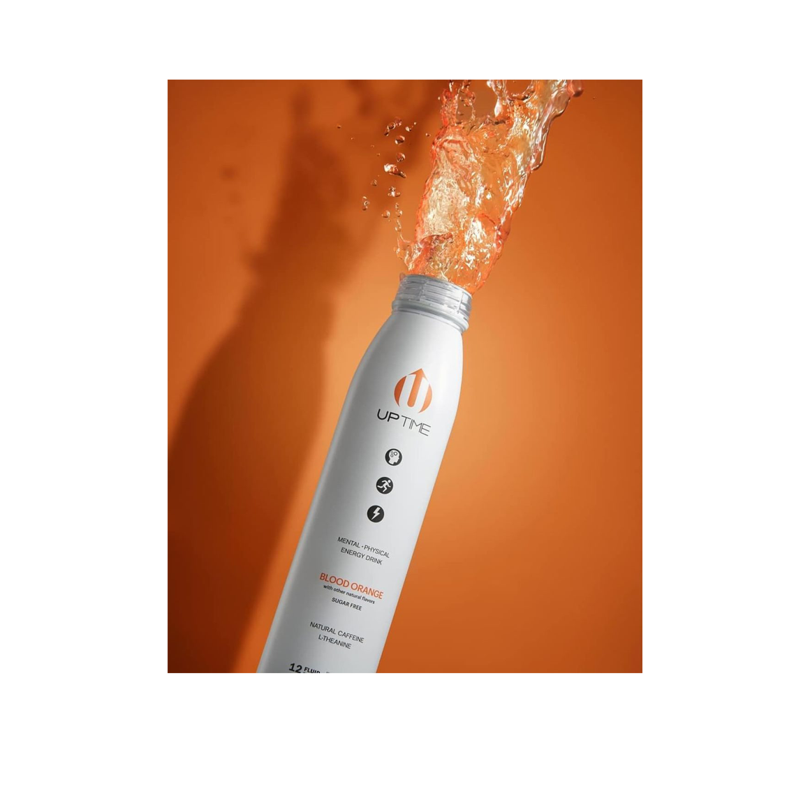 bursting bottle of uptime blood orange energy drink Image3