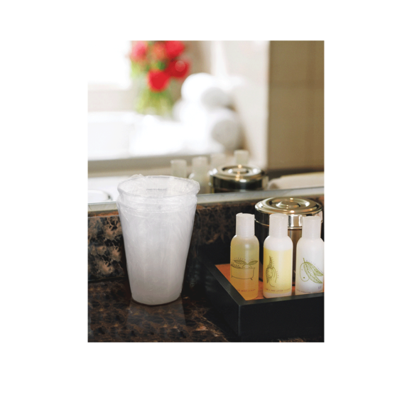 Stack of Conex disposable cups on bathroom counter Image1