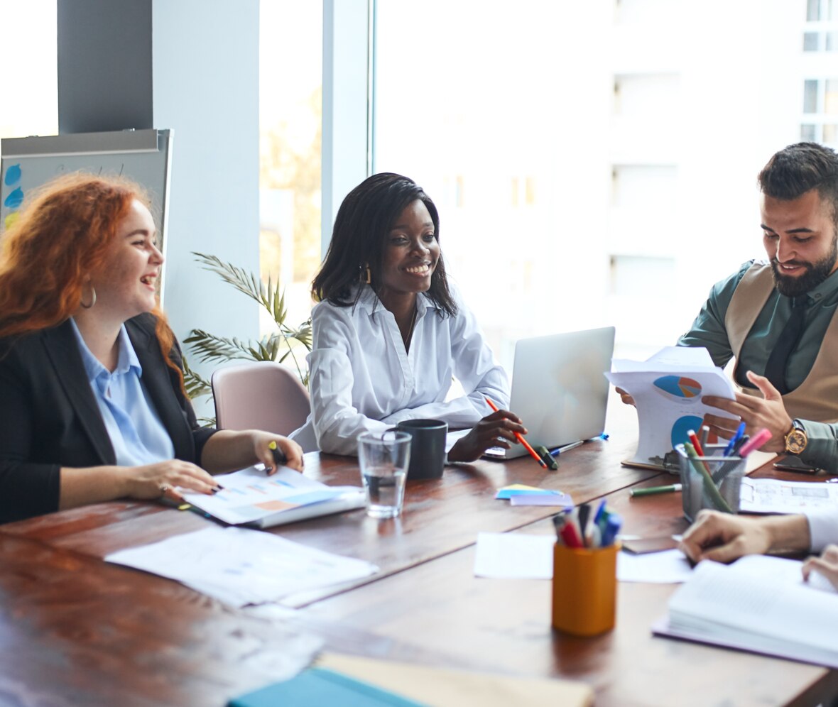 three people in an office meeting
