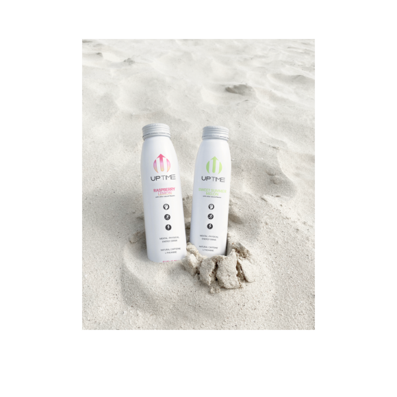 bottles of uptime raspberry lemon and uptime sweet summer melon sitting in the sand Image2